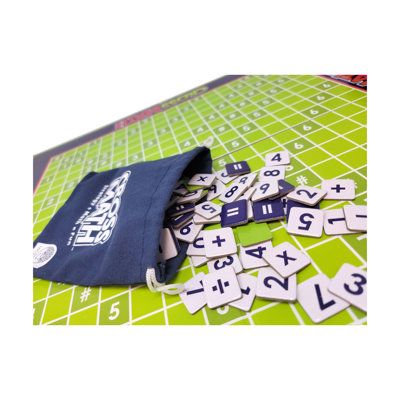 a bag filled with wooden numbers sitting on top of a table