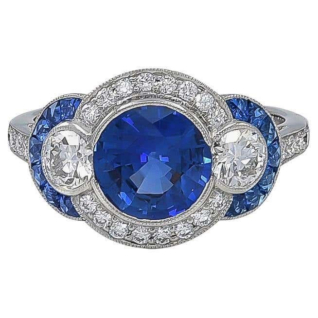 Royal Blue Sapphire Ring With Brilliant Cut, Royal Blue Brilliant Cut Sapphire Ring, Classic Blue Diamond Ring, Luxury Royal Blue Sapphire Round Ring, Classic Blue Halo Ring, Classic Blue Sapphire Diamond Ring, Platinum Blue Sapphire Gemstone Ring, Blue Sapphire Gemstone Ring In Platinum, Classic Blue Brilliant Cut Diamond Ring