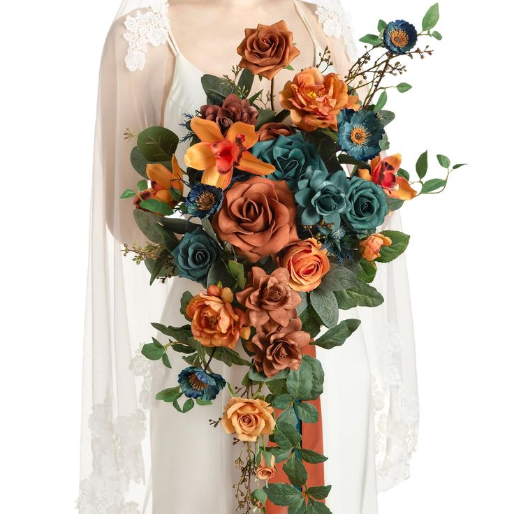 a woman wearing a white dress holding a bouquet of orange and blue flowers in her hands