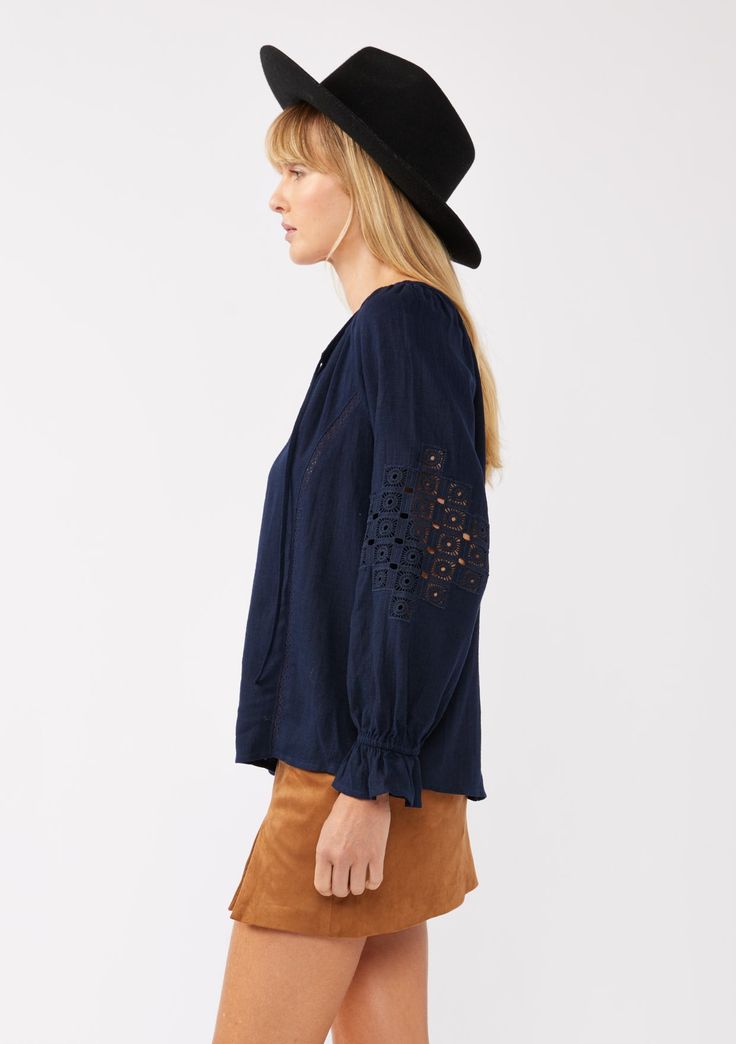 Meet your new boho favorite—our ultra-flowy peasant blouse, crafted from a dreamy rayon and linen blend for a cool, breathable feel. Featuring long sleeves with pretty embroidered lace details, ruffled elastic cuffs, and a split v-neckline with ties. Tuck it into your favorite denim for an effortless Fall ensemble that feels as timeless as it looks. Embroidered Lace insert Relaxed fit Long sleeve Ruffled elastic wrist cuff Hip length Split v-neckline with ties Women's bohemian top Dry clean recommended or hand wash cold Model is 5'9, wearing a size S.Style: I-15434W-SAH Long Sleeve Linen Peasant Top For Spring, Spring Bohemian Linen Blouse, Chic Linen Peasant Top For Spring, Fall Linen Blouse For Brunch, Floral Embroidered Linen Tops For Fall, Linen Tops With Floral Embroidery For Fall, Fall Linen Tops With Floral Embroidery, Fall Brunch Blouse With Lace Trim, Fall Peasant Top With Smocked Cuffs For Brunch