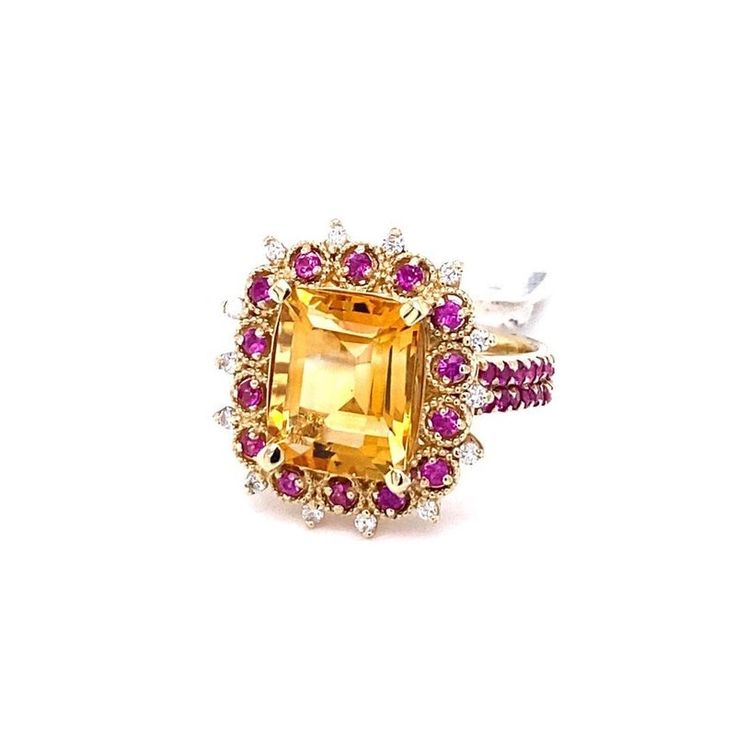 5.31 Carat Citrine Sapphire Diamond Yellow Gold Engagement Ring  This gorgeous ring has a beautiful Emerald Cut Citrine Quartz weighing 4.32 Carats and is surrounded by a total of 42 Pink Sapphires weighing 0.85 Carats and 14 Round Cut Diamonds weighing 0.14 Carats (Clarity: SI2, Color: F) . Each stone is handpicked and carefully curated to create a unique piece by our in-house designer and jeweler! The Citrine measures at 12 mm x 10 mm and the total carat weight of the ring is 5.31 Carats. It i Luxury Multi-stone Yellow Gemstones, Luxury Yellow Multi-stone Gemstones, Luxury Multi-stone Yellow Diamond Ring, Yellow Multi-stone Sapphire Ring, Luxury Yellow Sapphire Multi-stone Ring, Luxury Yellow Gemstones With Accent Stones, Yellow Gemstones With Accents Fine Jewelry, Yellow Multi-stone Diamond Ring Fine Jewelry, Yellow Multi-stone Diamond Ring In Fine Jewelry Style