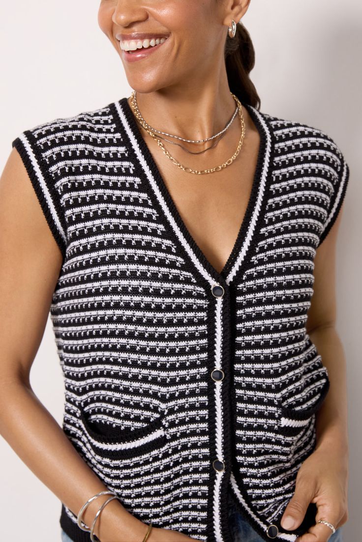 A chic addition to your wardrobe, the Willa sweater vest by EVEREVE features a sleeveless, slightly cropped silhouette with front pockets and button closures. Style for the season with jeans or trousers. | EVEREVE Women's Willa Lady Like Vest, Size XL, Black Trendy Knit Vest For Day Out, Layering Sweater Vest With Pockets, Chic Black Knit Vest, Trendy Sleeveless Sweater For Work, Chic Black Sleeveless Sweater, Sleeveless Sweater Vest With Pockets For Layering, Sleeveless Black Sweater For Work, Black Sweater Vest For Spring Workwear, Spring Black Sweater Vest For Work