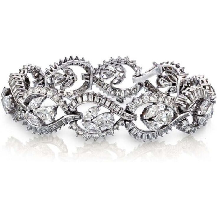 Capture the essence of timeless elegance with our exquisite Circa 1960's Platinum Diamond Bracelet. This stunning piece of jewelry encapsulates the allure of the bygone era, adding a touch of vintage glamour to any ensemble. Crafted with meticulous attention to detail, this bracelet features approximately 18.50 carats of dazzling diamonds that radiate brilliance from every angle.The centerpiece of this magnificent bracelet is a captivating diamond with a weight of 18.50 carats. Its scintillating Vintage Hand Set Diamond Bracelet, Vintage Diamond Bracelet With Hand-set Diamonds, Vintage White Gold Diamond Bracelet With Brilliant Cut, Vintage Brilliant Cut Tennis Bracelet For Wedding, Vintage Diamond Bracelet With Brilliant Cut For Formal Occasions, Vintage Diamond Tennis Bracelet With Single Cut Diamonds, Vintage Brilliant Cut Diamond Bracelet For Wedding, Vintage Diamond Bracelet For Anniversary, Vintage Formal Diamond Bracelet With Hand Set