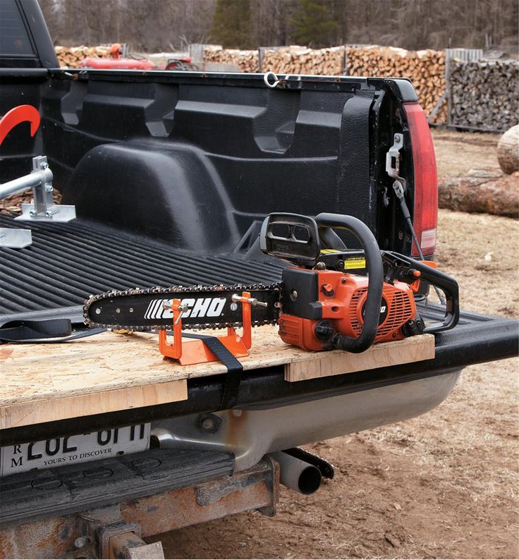 a chainsaw on the back of a pickup truck