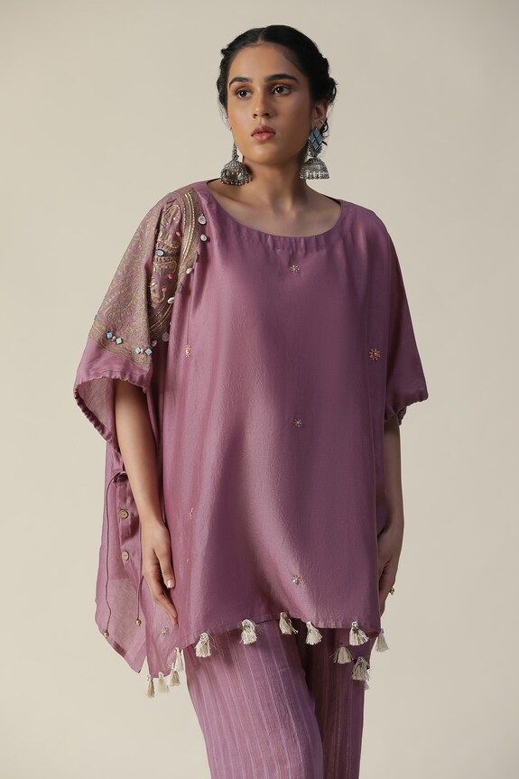 Purple kaftan featuring side foil printed mandala motifs, embellished by beads, shells and tassels. Comes with striped pant. - Aza Fashions Mauve Fabric, Printed Kaftan, Foil Printing, Short Kaftan, Striped Pant, Pant For Women, Cord Set, Cape Sleeves, Embroidered Shorts