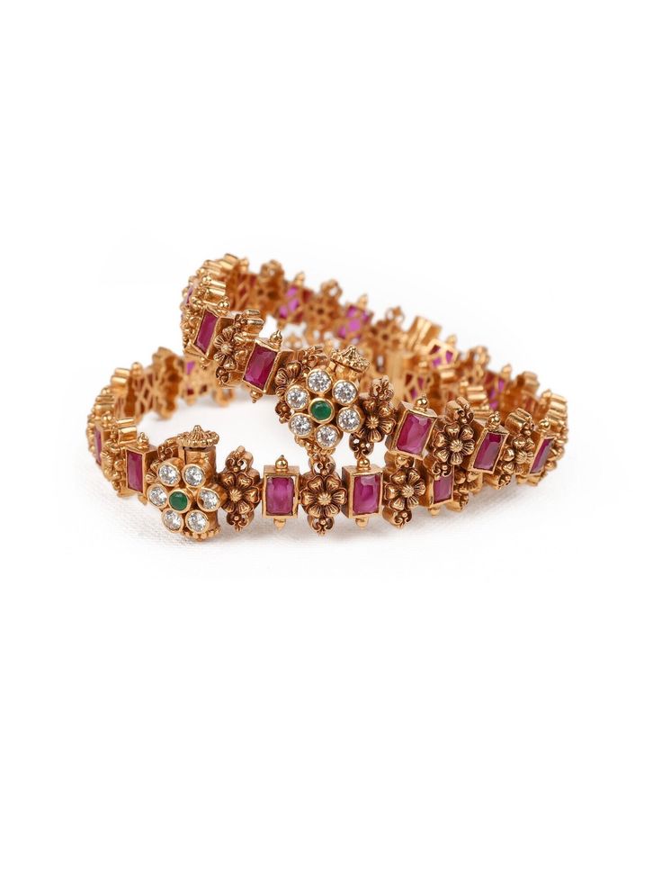 This 925 silver Bangle/Kada with screw, meticulously adorned with a lustrous gold polish, epitomize refined elegance. This kada features flower designs and red ruby kemp, green emerald and white zircon stones studded on the bangles make for an exquisite complement to opulent Indian ensembles like a lavish salwar kurta or a resplendent saree. This item is sold in Pairs. Available size: 2.6 size. Condition: New. This product is intricately designed and meticulously handcrafted with exceptional car Wedding Jewelry Bangle With Jewels, Silver Jewelry For Marriage And Festivals, Sterling Silver Toe Ring In Temple Jewelry Style, Traditional Silver Bracelets For Marriage, Traditional Silver Bracelet For Marriage, Jeweled Toe Ring For Wedding, Hand Set Jewelry For Marriage, Wedding Jeweled Bangle, Jeweled Bracelets For Festivals