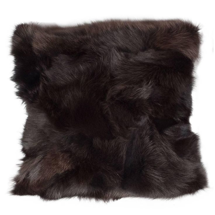 a black fur pillow on a white background