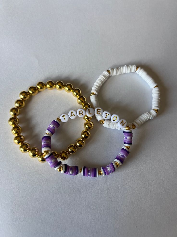 These Bracelets are a perfect way to show your school spirit on game day! They are also fully customizable and make a great gift! School Pride Bracelets, School Spirit Letter Beads Bracelets Gift, Customizable Adjustable Purple Name Bracelet, Customizable Purple Name Bracelet With Adjustable Fit, Customizable White Wristband For Everyday, Personalized Team Spirit Beaded Bracelets For Gift, Customizable Adjustable Bracelets With Team Spirit, White Team Spirit Stretch Bracelet As Gift, Personalized Team Spirit Stretch Bracelet As A Gift