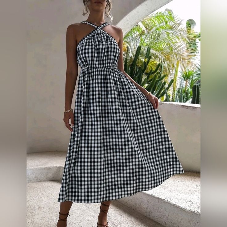 Flowy Chic Gingham Checked Halter Midi Dress * Sleeveless * Criss Cross Halter Neckline, Elastic Back * Flared A Line Skirt * Pullover * High Waist *Approximate Unstretched Measurements* Small 4 *Bust 26.75-39.25" *Waist 26-45" *Length 37" Medium 6 *Bust 28.25-41" *Waist 27.5-48" *Length 37.5" Large 8/10 *Bust 30.5-43" *Waist 30-51" * Sleeve Length 15.5" * Length 38.25" Xl 12 *Bust 33-45" *Waist 32-53" Sleeve Length 15.5" * Length 39" ** On Order ** Will Ship In 7- 14 Days * Fabric Flowy Poly Co Sleeveless Plaid Dress For Picnic, Sleeveless Black Plaid Dress For Spring, Chic Sleeveless Plaid Dress For Picnic, Plaid Sleeveless Dress For Picnic, Plaid Sundress For Vacation, Chic Plaid Beach Dress, Summer Plaid Black Dress For Picnic, Chic Plaid Dress For The Beach, Casual Plaid Midi Dress For Picnic