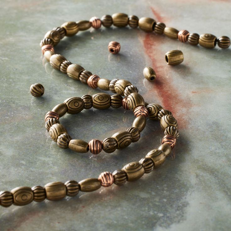 a long beaded necklace on a table