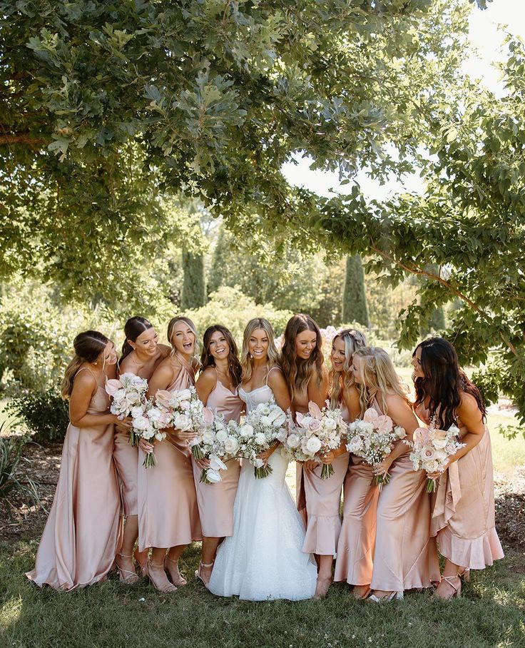 Bridsmaids and Bride smiling and laughing at eachother Show Me Your Mumu Bridesmaid Pink, Plush Pink Bridesmaid Dresses, Wedding Bridesmaid Dresses Rose Gold, Bridesmaid Dresses Silk Pink, Wedding Rose Gold Bridesmaid Dresses, Brides Made Dresses Pink, Bridesmades Dresses Pink, Blush Color Bridesmaid Dresses, Peachy Bridesmaid Dresses