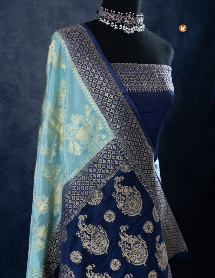 Indulge in luxury with our Sky Blue Khaddi Silk saree, adorned with delicate Golden Jaal work. Featuring a lightweight and airy fabric, this saree offers both comfort and elegance. Elevate your style with this beautiful saree and leave a lasting impression on any occasion! Luxury Blue Katan Silk Dupatta, Luxury Royal Blue Banarasi Silk Dupatta, Blue Tissue Silk Pre-draped Saree For Designer Wear, Blue Tissue Silk Pre-draped Designer Saree, Designer Blue Tissue Silk Pre-draped Saree, Blue Silk Anarkali Pre-draped Saree, Blue Bollywood Style Pre-draped Tissue Silk Saree, Blue Tissue Silk Sharara For Navratri, Blue Pre-draped Saree With Unstitched Blouse In Tissue Silk