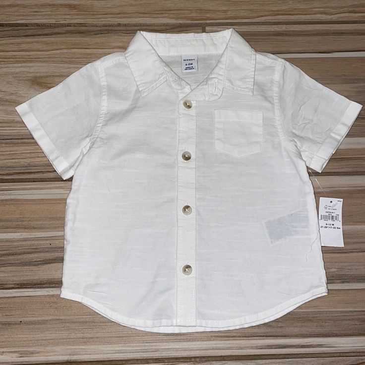 White Button Down Collared Shirt By Old Navy Is 100% Cotton But Has A Beachy, Linen Look. Adorable Fit. Brand New With Tags. Size: 6-12 Months Cotton Tops With Pockets For Playtime, Short Sleeve Tops With Pockets For Playtime, Casual Summer Shirt For Playtime, Casual Tops With Pockets For Playtime, Collared Summer Tops For Playtime, Summer Cotton Tops With Snap Buttons, Collared Tops For Summer Playtime, Spring Cotton Shirt For Playtime, Summer Collared Tops For Playtime