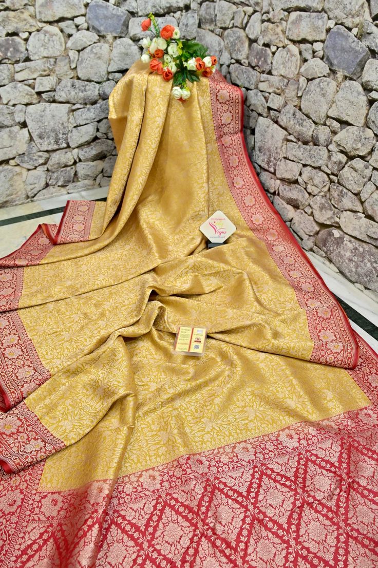 A stunning saree for amazing parties, available in golden yellow color with full-body having a traditional golden matte finish zari work in a paisley motif pattern with filigree style weaving on the pallu and the border makes this silk mark tanchoi double katan a must-buy. Color: A shade of golden yellow color Technique: Amazing work of golden antique finish zari work on the body in alternate arrangement with traditional weaving on the pallu and the border Fabric: Katan Silk Quality: Indyvogue's Assurance of Pure Silk Mark Certified Saree Gold Banarasi Silk Lehenga For Festive Occasions, Elegant Gold Lehenga With Self Design, Yellow Brocade Traditional Wear With Zari Work, Gold Dupatta For Puja With Traditional Drape, Wedding Pashmina Shawl With Pallu In Tussar Silk, Wedding Tussar Silk Pashmina Shawl With Pallu, Wedding Raw Silk Pashmina Shawl With Zari Weaving, Yellow Brocade Traditional Wear For Diwali, Yellow Brocade Traditional Wear For Festive Occasions