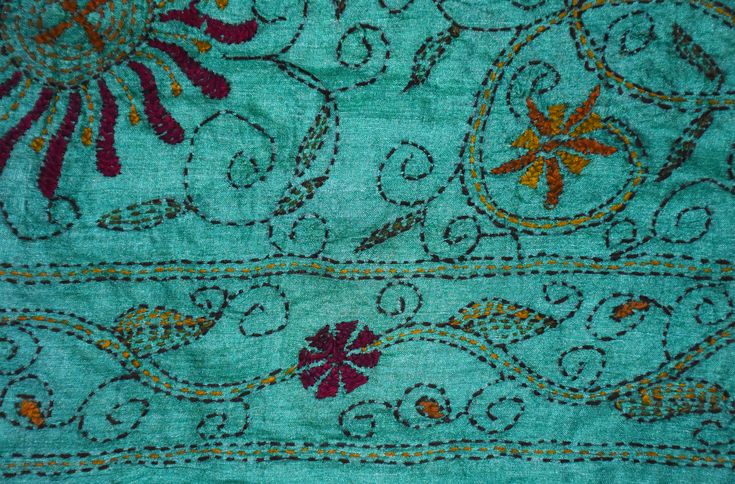 an old blue cloth with floral designs on it