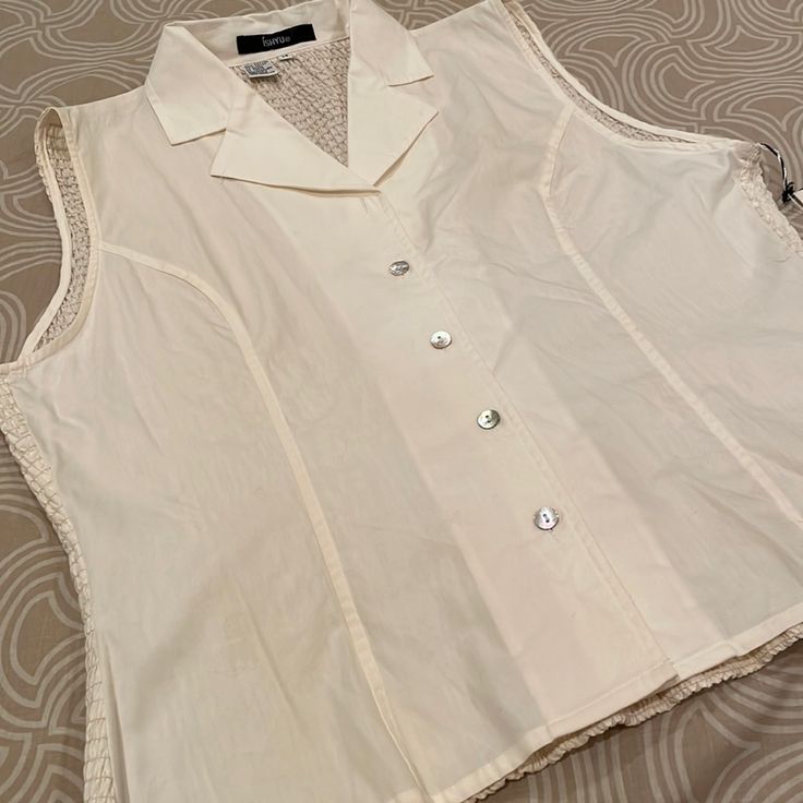 This Unusual Blouse Is By Ishyu In Size 14. It Is Made Of 100% Cotton And It Is Hand Washable. It’s In Brand New, Never Worn Condition. And The Pit To Pit Measurement Is 21 Inches. The Length Is 23 Inches. Classic White Sleeveless Tank Top, Classic Cream Sleeveless Top, Classic Sleeveless Cream Top, Classic Sleeveless Summer Vest, Elegant White Vest Top, Classic Sleeveless Tank Top For Summer, Classic Beige Sleeveless Tank Top, Classic Sleeveless Summer Tops, Classic Beige Vest Top