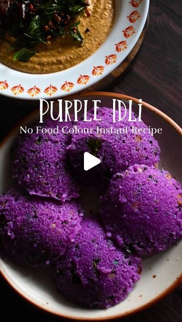 purple food is on a plate next to a bowl of hummus and spinach