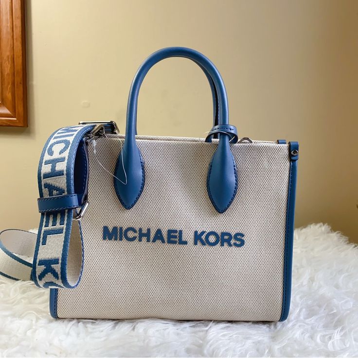 Brand New With Tag, 100% Authentic Crossbody Bag 9.25”W X 7.75”H X 3.75”D Handle Drop: 3.25” Adjustable Strap: 20.25”-23.75” Interior Details: Back Zip Pocket, Front Slip Pocket Lining: 100% Polyester Zip Fastening Imported Michael Kors Everyday Satchel With Double Handle, Michael Kors Double Handle Satchel For Everyday, Michael Kors Satchel With Top Carry Handle, Michael Kors Satchel With Double Handle, Michael Kors Tote Satchel With Top Carry Handle, Michael Kors Double Handle Satchel With Top Carry, Crossbody Bag In Coated Canvas With Handles, Michael Kors Everyday Shoulder Satchel, Michael Kors Satchel Tote With Detachable Handle