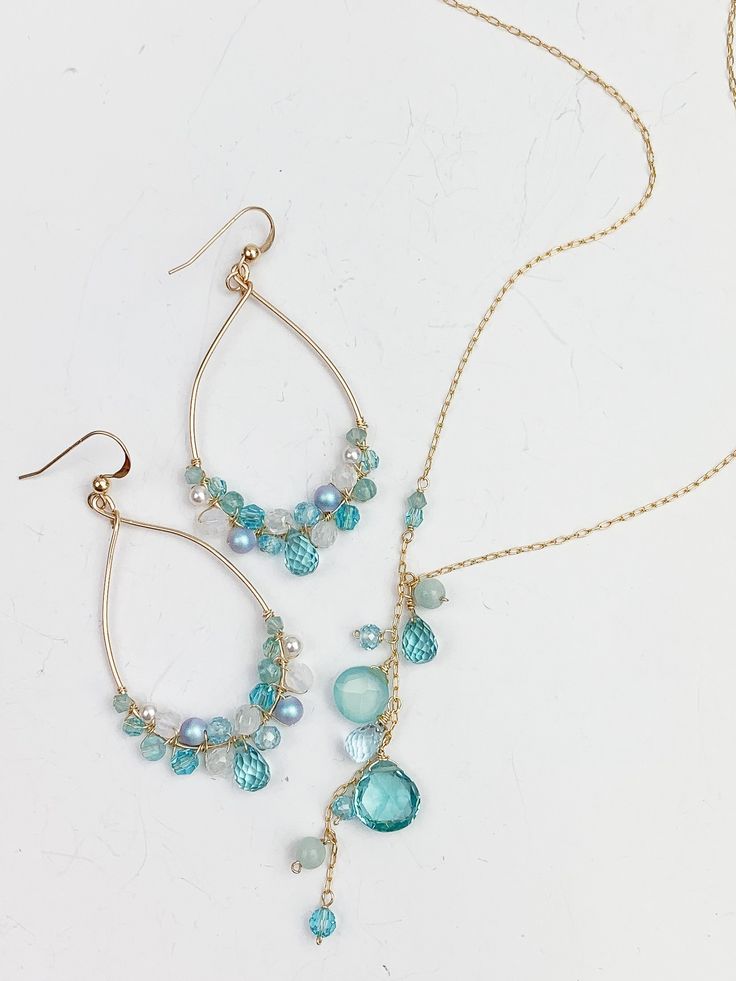 Discover our Aqua Quartz Collection - a must-have for aquamarine lovers! Immerse yourself in the tranquil allure of oceanic beauty, reminiscent of Seaglass hues. Featuring my signature Anna hoops adorned with ombre aquatic gems, available in 14k Gold-Filled or Sterling Silver. Elevate your look with our sophisticated Y-style necklace, meticulously crafted in 14k Gold-Filled (also offered in silver), adjustable from 17 to 19 inches for the perfect fit. Complete your ensemble with coordinating 1.7 Chocolate Jewelry, Aqua Necklace, Hoops Silver, My Signature, Gemstone Jewellery, Style Necklace, Real Gold, Gold Vermeil, Silver Necklaces