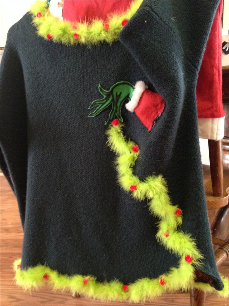 an ugly sweater with green and red decorations on it