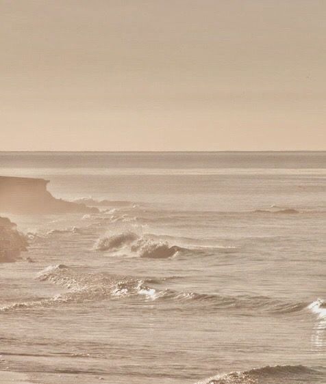 two surfers are riding the waves in the ocean