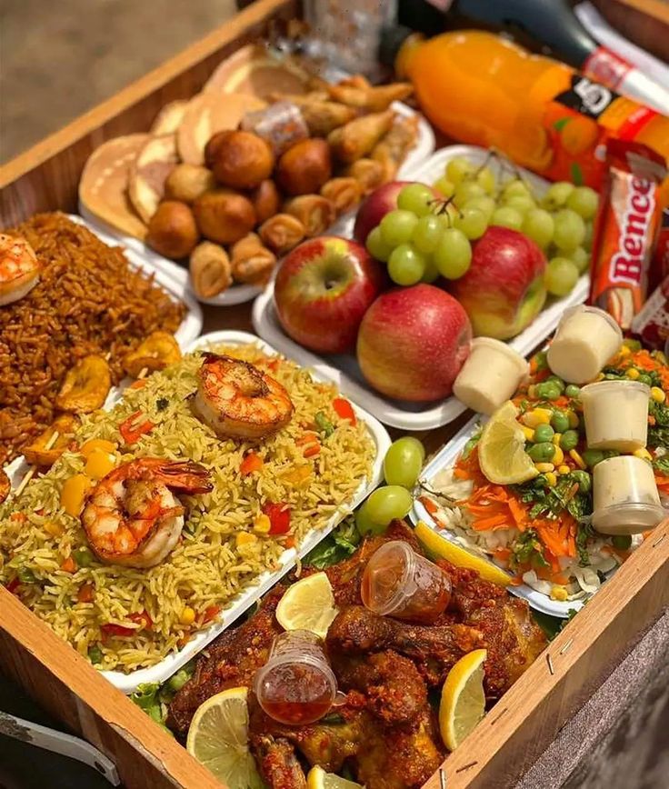 a wooden box filled with lots of different types of food on top of a table