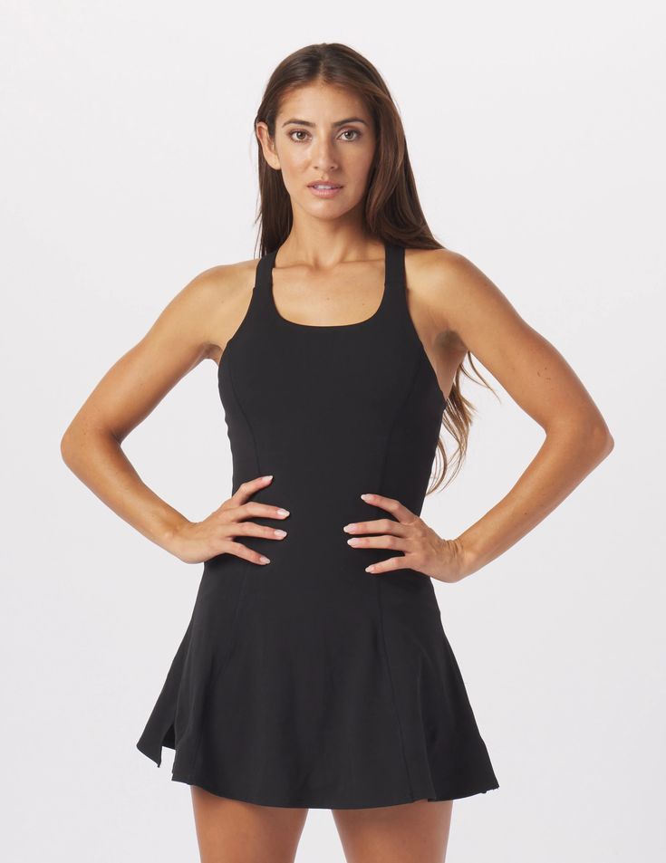 A dress that's made to move in! The Full Force dress is all about function, support, and fashion! Thick crossover straps, maximum support bra and built-in shorts keep everything in place, and a fit and flare A-line silhouette maximizes comfort and flattering style. 32" length. We recommend sizing up for this dress. Fitted Sleeveless Tennis Dress With Built-in Bra, Sporty Fitted Dress With Built-in Shorts, Sporty Mini Dress With Built-in Bra For Workout, Black Tennis Dress With Built-in Bra For Summer, Black Summer Tennis Dress With Built-in Bra, Black Sleeveless Tennis Dress With Built-in Bra, Black Tennis Dress With Built-in Bra, Fitted Black Tennis Dress With Built-in Bra, Stretch Sleeveless Dress With Built-in Shorts