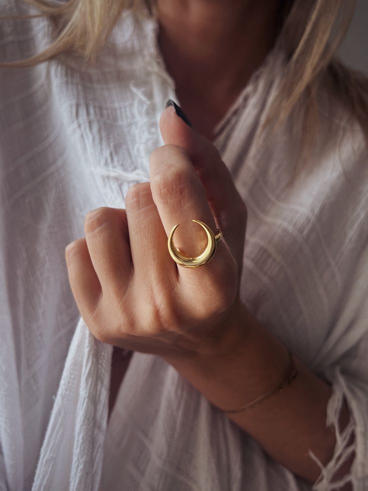 This ring is a piece from Keras collection.Sculptured and casted in solid sterling silver 925 and then double gold plated with 22k gold.Very nice and important weight. The crescent is 20mm (0.787 inch)  All of my jewelry is handmade please allow for small variances from piece to piece ,as this is a feature of owning one of a kind original handmade jewelry.  Feel free to ask me for personal orders . -22k gold platted Sterling silver 925 You may also like on bright silver  https://www.etsy.com/lis Mystical Open Ring Promise Ring, Mystical Moon Phase Promise Ring, Gold Adjustable Ring With Moon Charm, Adjustable Gold Ring With Moon Charm, Elegant Crescent Moon Charm Rings, Spiritual Crescent Moon Charm Ring, Gold Sterling Silver Ring With Moon Charm, Yellow Gold Moon Phase Ring Jewelry, Yellow Gold Moon Phase Ring