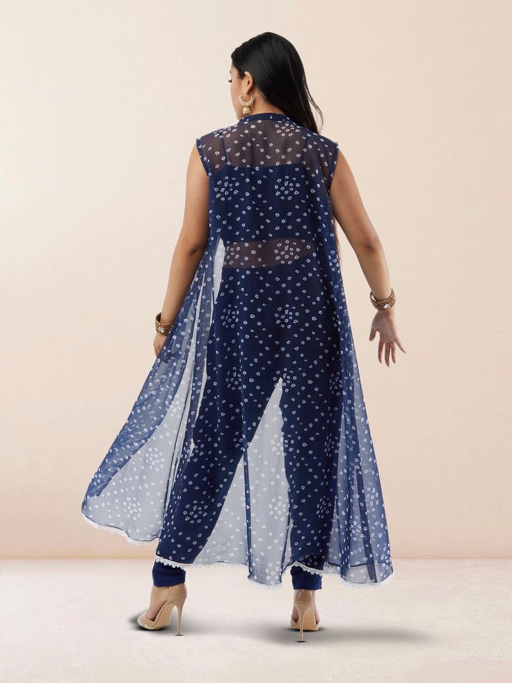 Step out in style with our Vibrant Verve Blue Bandhani Chiffon three Piece Suit. This elegant Indo Western ensemble features a beautiful blue Bandhani design on flowing chiffon fabric, exuding a perfect blend of traditional and contemporary charm. The three-piece suit includes a top, bottom, and dupatta, offering versatility and sophistication for various occasions. Care Instructions: Dry clean recommended to maintain the fabric's quality and colors. Festive Sheer Georgette Dresses, Sheer Georgette Dress For Eid, Blue Georgette Maxi Length Set, Blue Georgette Dress With Traditional Drape, Sheer Georgette Sets For Eid, Sleeveless Georgette Dress For Eid, Blue Georgette Sets For Summer, Traditional Sheer Georgette Dress, Summer Blue Georgette Sets