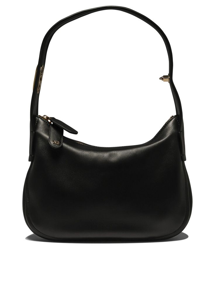 Find VALENTINO Go-hobo' Shoulder Bag on Editorialist. The Valentino Garavani 'Go-Hobo' shoulder bag is crafted from 100% leather and features a gold tone logo and a top handle. It measures 30 x 18 x 5 centimeters. The bag can be worn on the shoulder. Valentino Garavani Bag, Leather Cap, Black Shoulder Bag, Handbag Accessories, Valentino Garavani, Shoulder Bag Women, Luggage Bags, Womens Shoes Sneakers, Pumps Heels