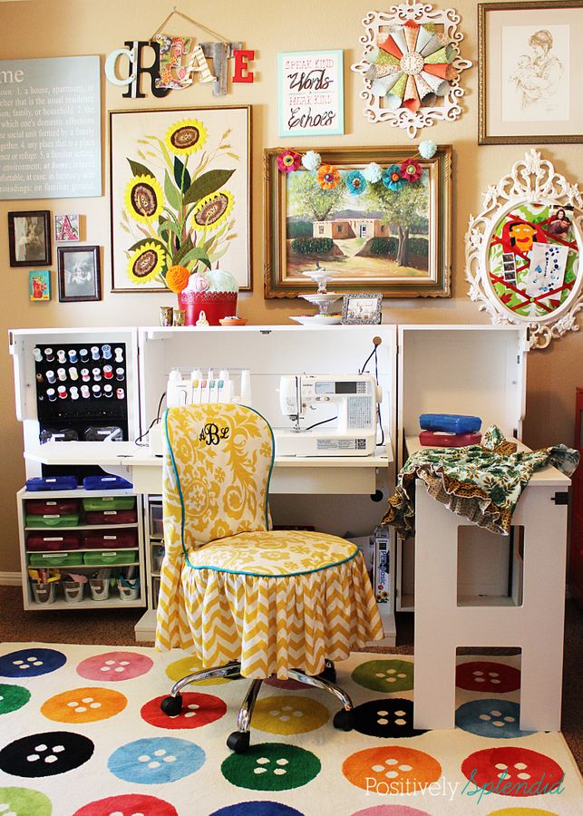 a room filled with lots of colorful pictures and art on the wall above a computer desk