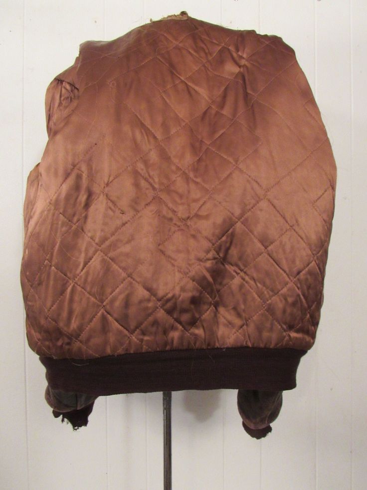 "Vintage 1950s brown leather motorcycle/bomber A-2 style jacket. It looks like it might be horsehide. Has two double pockets, zip front and quilted lining. Nice natural patina and distress. Size medium. Actual measurements are: 43\" at the chest 36\" at the unstretched waist Shoulder seam to shoulder seam: 18\" Shoulder seam to cuff: 25\" Overall length: 29\" In good condition with worn cuffs(photos), wear hole in lining at neck(photo) and bottom of zipper tine is 1/2 pulled from fabric(photo), Retro Brown Outerwear With Zipper Closure, Vintage Brown Leather Jacket With Zipper, Vintage Brown Outerwear With Zipper Closure, 1950s Jacket, Vintage Brown Distressed Biker Jacket, Vintage Brown Biker Jacket With Zipper Closure, Brown Vintage Biker Jacket With Zipper Closure, Vintage Brown Leather Jacket With Zipper Closure, Vintage Faded Pre-washed Outerwear