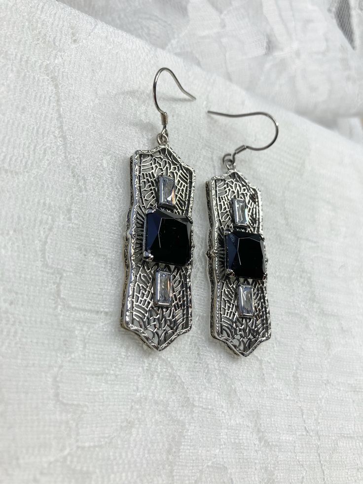 "Black Cubic Zirconia Earrings Square Peg Design#E63 Custom Made About 12 months ago I found a lovely Art Deco brooch and fell in love with the design. Fashioned in the design of the brooch, I now offer these lovely Antique reproduction earrings in sterling silver (matching pendant also available for sale in my store). The 3ct simulated black cubic zirconia gemstone is 10mm in L & W (3/8th\"). The 2 baguette CZ gems are 6mm x 3mm. The pendant is 1 3/4 inches long, it is just shy of 5/8th\" a Black Diamond Cubic Zirconia Earrings As Gift, Black Art Deco Earrings For Evening, Classic Black Diamond Earrings For Gift, Black Diamond Drop Earrings Gift, Black Cubic Zirconia Jewelry With Matching Earrings, Gift Black Diamond Drop Earrings, Black Cubic Zirconia Earrings For Evening, Ornate Black Sterling Silver Jewelry, Sterling Silver Earrings With Black Diamonds For Anniversary