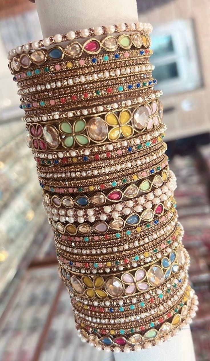 These gorgeous sets of chudiyan/Bangles consists of different designs of bangles including wide and small kangans which can be worn on its own or with bangles included in the set.Each set contains 32 bangles 2 x large multi Kangan and 4 x small multi Kangan which are sets for both hands Photos are of real products so you can buy with confidence  For more products,photos and videos of these products please check our instagram page @pearljewelleryempire Feel free to contact anytime NO RETURNS OR E Traditional Cheap Festival Bangle, Chudiyan Bangles, Ladies Bangles, Hands Photos, Desi Love, Page Instagram, The Bangles, Thread Bangles, Bangles Indian