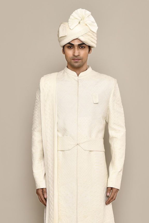 Ivory sherwani with thread, french knots embroidery in diamond pattern. Paired with kurta, churidar, dupatta and belt. Comes with safa, juttis, sevra and tanni. - Aza Fashions Elegant Cream Bandhgala With Chikankari Embroidery, Ceremonial Off White Sherwani With Pallu, Ceremonial Off-white Sherwani With Pallu, Off White Sherwani With Pallu For Reception, Ceremonial Off White Bandhgala With Pallu, Cream Nehru Jacket With Naqshi For Reception, Formal Off White Kurta With Cutdana, Traditional Cream Nehru Jacket With Pallu, Formal Off-white Kurta With Cutdana