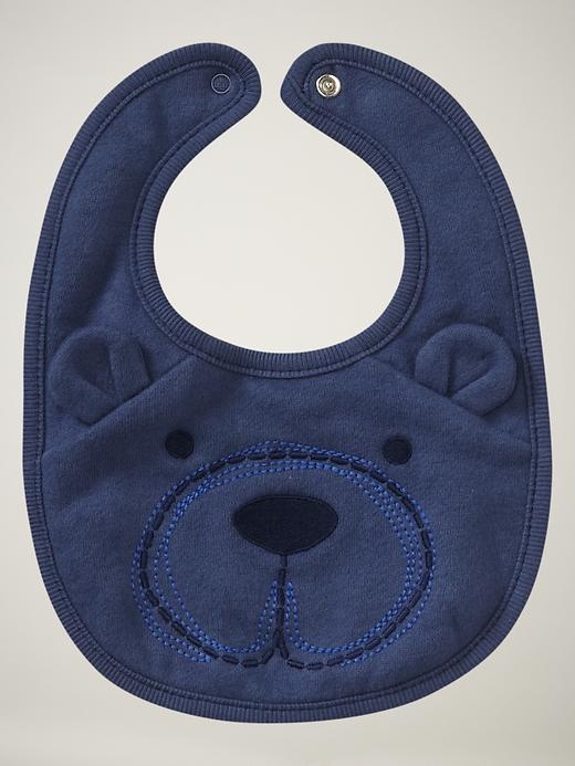 a baby bib with a bear face on it's front and back side