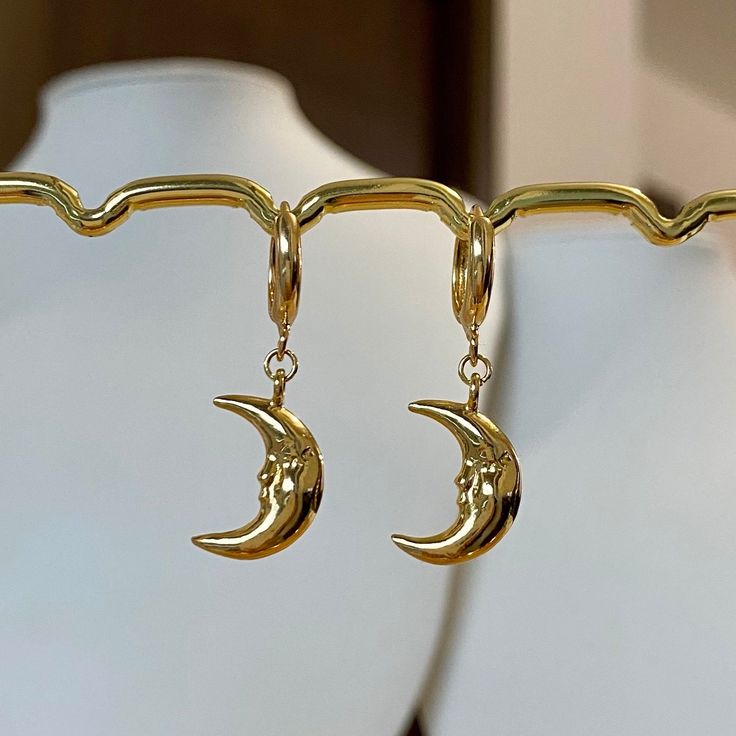 🌙Gold plated Crescent moon hoop earrings, Crescent moon huggies, Crescent moon dangle earrings Crescent moon dangle earrings are a popular style of earrings that feature a design resembling the shape of a crescent moon🌙 they gently sway and catch the light as you move, making them eye-catching and charming earrings🌝💛 * Hypoallergenic jewelry  * Hoop size: 11mm * Charm size: 13mmx11mm * Gold plated brass It comes with gift wrapped🎁 Free tracked shipping in the UK🚛 Shipped same or next business day🤍 Message me anytime for any questions💙   All earrings can also be made into necklaces.            Please message me separately ❤️ Follow us on Instagram: blueminglondon ❤️ Earrings Hypoallergenic, Crescent Moon Earrings, Crescent Moon Necklace, Hypoallergenic Jewelry, Jewelry Lookbook, Moon Earrings, Moon Necklace, Fun Earrings, Cute Earrings