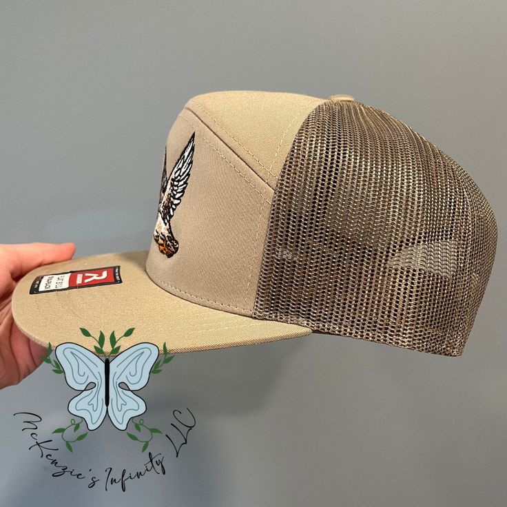 Experience the great outdoors in style with our Mallard Duck Embroidered Richardson 168 Trucker Cap. The stunning embroidered design adds a touch of wildlife to your wardrobe. The 7-panel construction and adjustable fit provide comfort for all-day wear. Perfect for any avid nature enthusiast! 60/40 cotton/polyester, twill 100% polyester mesh back Structured, seven-panel, Hi pro profile Flat bill Adjustable snapback closure Casual Outdoor Trucker Hat With Embroidered Patch, Outdoor Trucker Hat With Embroidered Logo, Casual Outdoor Snapback Hat With Embroidered Patch, Khaki Trucker Baseball Cap For Outdoor, Khaki Trucker Hat For Outdoor, Khaki Curved Bill Snapback Hat For Outdoor, Khaki Snapback Trucker Hat For Outdoor Activities, Khaki Trucker Snapback Hat For Outdoor, Outdoor Trucker Hat With Embroidered Patch