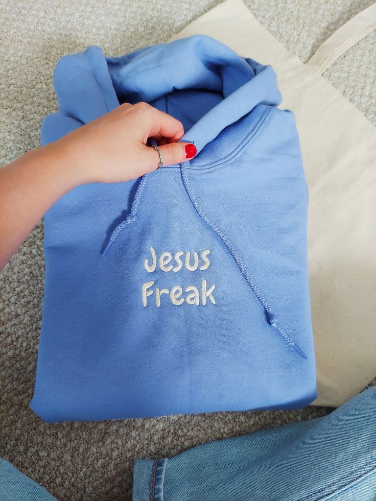 Diy Christian Shirts, Christian Hoodie Ideas, Jesus Sweatshirts Hoodies, Jesus Merch Aesthetic, Cool Shirt Ideas, Christian Embroidered Sweatshirt, Cute Christian Sweatshirts, God Sweatshirts, Church Merch Ideas