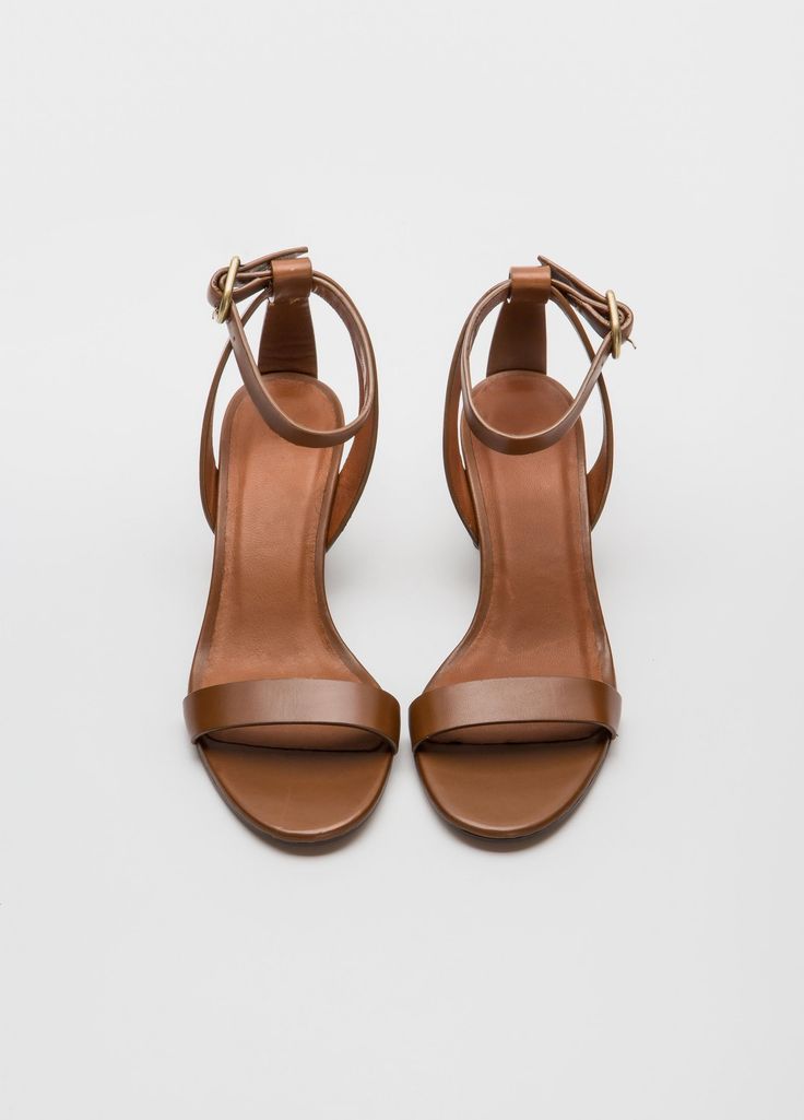 Simply chic - and able to coordinate with everything - our Filene Sandal will be a go to summer favorite.  In black or burnished brown, the mid height heel and sleek straps look perfect with everything from jeans, to a simple sheath dress.  Upper Material: Genuine LeatherOrigin: CN ImportedHeel Height: Med (3cm-5cm)With Platforms: NoOccasion: Dress, Daily, WorkSandal Type: GladiatorHeel Type: Square heelLining Material: LeatherSide Vamp Type: OpenOutsole Material:  LeatherItem Type: SandalClosure Type: Buckle StrapFit: Fits true to size, take your normal sizeBack Counter Type: Ankle StrapAge: 18 - 65, AnyStyle: RomanPattern Type: SolidInsole Material: Pig SplitGender: Women Classic 4-inch Heels For Summer, Brown Low Heel Heels With Buckle Closure, Classic Summer Heels With Padded Heel, Elegant Brown Sandals With 4-inch Heel, Classic Medium Width Sandals For Work, Chic Penny Strap Sandals, Classic Sandals With Heel Strap For Work, Leather Sandals With Sculpted Heel For Date Night, Leather Sandals With 4-inch Heel For Date Night