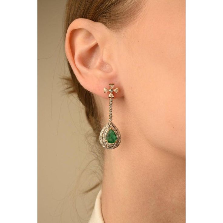 This is part of Chairish’s Fine Jewelry assortment.  Emerald Dangle Drop Earrings in 14K Gold with Diamonds to make a statement with your look. These earrings create a sparkling, luxurious look featuring pear cut gemstone. Emerald enhances the intellectual capacity.  Designed with pear cut emerald with diamonds around dangling on the end of diamond strand with diamond flower on top. This beautiful handcrafted emerald and diamond earrings are great wedding gift for anyone on your list.   PRODUCT Luxury Teardrop Diamond Earrings, Elegant Diamond Teardrop Earrings For Party, Luxury Teardrop Earrings With Diamond Accents, Luxury Pear-shaped Teardrop Earrings For Formal Occasions, Elegant Pear-shaped Diamond Earrings For Evening, Elegant Gemstone Chandelier Earrings For Parties, Elegant Pear-shaped Jewelry For Evening, Timeless Teardrop Diamond Earrings For Evening, Elegant Pear-shaped Diamond Earrings For Pierced Ears