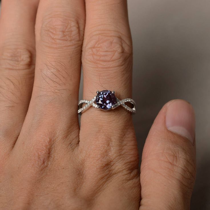 This is a gorgeous handmade creation. Its beauty is its simplicity & Elegance. The 7*7 mm round shape faceted lab Alexandrite is crafted in solid sterling silver and with rhodium plated. All item is sent in a beautiful gift box If you have any idea of design your ring,pls contact me directly. You can realize more lovely stuff clicking the link https://www.etsy.com/shop/knightjewelry?refshopsection_shophome_leftnav Please leave the correct address and you phone number for delivering successfu Silver Rings With Modern Twist And Round Cut, Modern Twist Silver Rings With Round Cut, Modern Twist Jewelry Ring With Brilliant Cut, Modern Twist Oval Rings For Anniversary, Modern Twist Brilliant Cut Ring Jewelry, Elegant Tanzanite Birthstone Ring For Promise, Silver Infinity Gemstone Jewelry, Silver Infinity Jewelry With Gemstone, Modern Twist Cubic Zirconia Ring