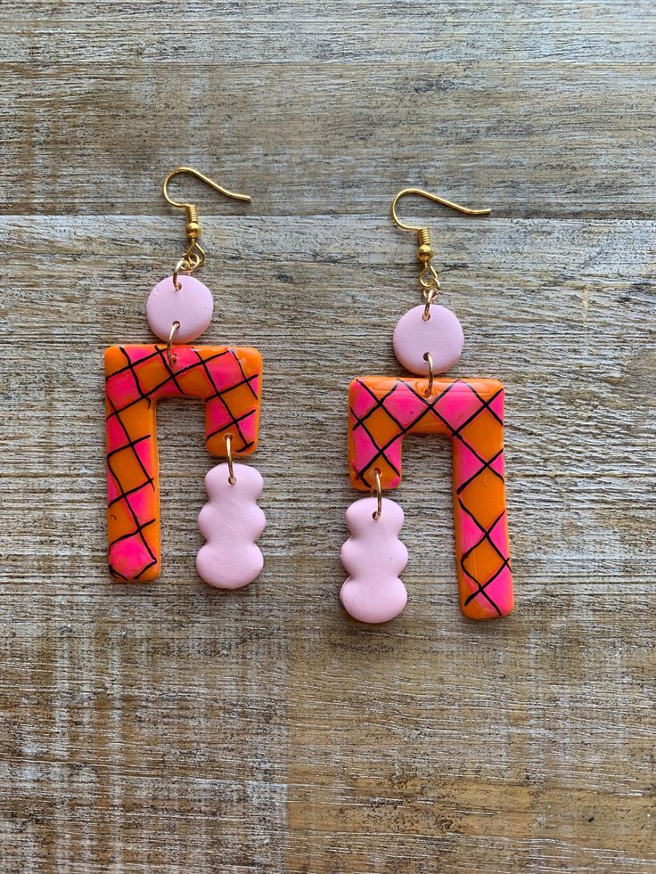 Checkerboard clay earrings!  Sealed with resin for a glossy shine, some small bubbles exist.  Regular Earrings- 3 7/8 inches long. (READY TO SHIP!) Tunnel Earrings- 4 3/8 inches long.  Clip On Earrings- 3 7/8 inches long.  measurements are approximate. Jewelry Care: to keep your jewelry in optimal condition avoid dropping them on a hard surface as this can cause chips or fractures of the polymer clay. Keep your jewelry in a dry box or container when not in use. Avoid direct contact of perfumes, lotions or cosmetics while wearing your jewelry. Playful Pink Resin Earrings, Playful Hand Painted Pink Earrings, Trendy Pink Clay Earrings, Funky Handmade Pink Earrings, Artsy Pink Polymer Clay Earrings, Pink Artsy Polymer Clay Earrings, Funky Pink Handmade Earrings, Handmade Retro Pink Earrings, Unique Pink Clay Earrings