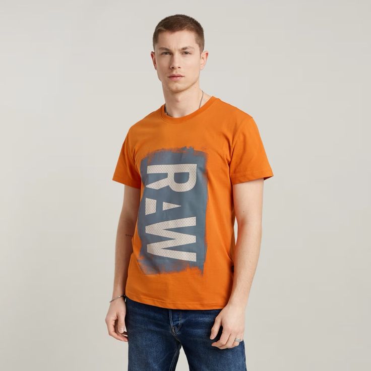 T-Shirt Painted Raw Graphic Is One Of Our Organic Cotton Graphic T-Shirts. This Straight Fit Version Features A Raw Print At The Front. Ribbed Neckline Straight Hem Graphic Raw Print At The Front Graphic Print At The Front G-Star Originals Label At The Lower Side Seam Sizing: Regular Fit Round Neck Short Sleeves Trendy Orange Cotton Shirt, Orange Relaxed Fit T-shirt With Letter Print, Relaxed Fit Orange Top With Letter Print, Orange Relaxed Fit Top With Letter Print, Orange Top With Letter Print And Relaxed Fit, Orange Crew Neck T-shirt, Orange Relaxed Fit T-shirt With Text Print, Orange Crew Neck Casual T-shirt, Casual Orange Tops With Screen Print