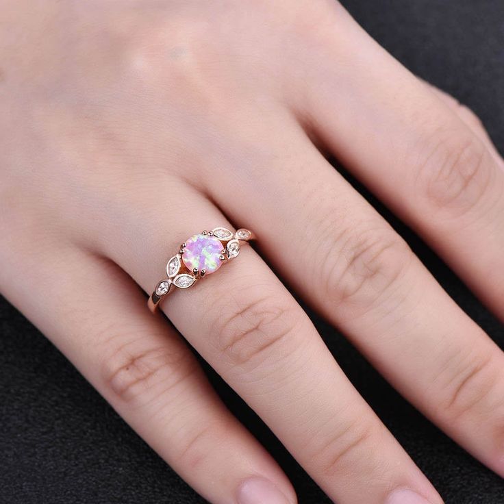 This is a beautiful lab created pink fire Opal and CZ diamond engagement ring in 925 sterling silver. Main Stone: 7mm round cut lab created pink fire opal. This ring is marked 925. I accept custom making order.Please contact me if you need this service. For special customized products,since it was custom made only for you,thank you for your understanding. For all the jewelries,there is a 14 days money back guarantee.You can return it in the time frame without any questions.However there maybe ha Pink Opal Ring With Accent Stones As Gift, Pink Crystal Promise Ring With Prong Setting, Pink Topaz Promise Ring With Prong Setting, Pink Opal Gemstone Ring For Anniversary, Pink Topaz Promise Ring With Center Stone, Pink Diamond Accented Promise Rings, Pink Topaz Promise Ring In Round Shape, Pink Round Topaz Promise Ring, Pink Rings With Diamond Accents For Promise Occasion