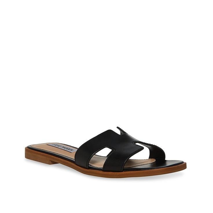 Steve Madden-Hadyn Sandal Look trendy and comfortable in the Hayden sandal by Steve Madden. Cut-out details create an edgy appeal to the leather sandal, completed by a square open toe. Leather Sandals With Square Toe For Vacation, Black Square Toe Slides For Spring, Leather Square Toe Mules For Beach, Leather Mules With Square Toe For Beach, Chic Beach Slides With Square Toe, Modern Square Toe Beach Sandals, Chic Sandals With Leather Footbed And Square Toe, Chic Square Toe Sandals With Leather Footbed, Summer Square Toe Mules With Leather Footbed