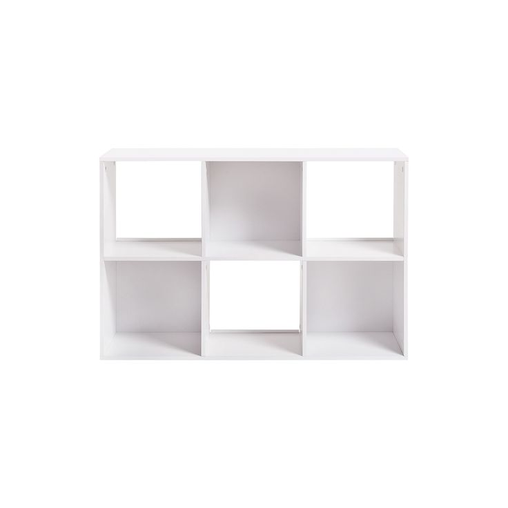 a white shelf with four sections on each side