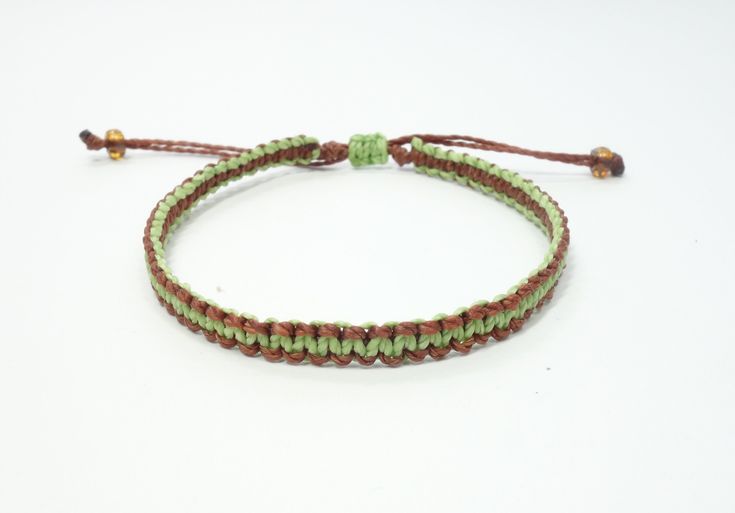 Handmade friendship bracelet. Braided waxed thread bracelet. Waterproof string bracelet. Adjustable unisex bracelet. Boho bracelet for women DESCRIPTION The two colour macrame square knot bracelet for men and women is made from 2ply polyester cord that is waxed for durability and has 6/0 Miyuki beads added to the pull-ends of the waxed polyester cord. The hand-tied knots will not fray and the bracelet is waterproof and washable. That means you can pull it on and never take it off. It is the perfect summer bracelet for surfers, sailors, and beach lovers alike. The price is for one bracelet. Real colors may slightly differ from one monitor to another, as it depends on specific monitor settings. This is a handmade item so please allow some small differences. Beautiful handmade gift wrapping n Casual Green Friendship Bracelets With Adjustable Cord, Casual Green Friendship Bracelet With Adjustable Cord, Casual Braided Friendship Bracelets With Waxed Cord, Friendship Braided Bracelet With Adjustable Nylon Cord, Green Adjustable Cord Friendship Bracelet, Casual Waxed Cord Braided Friendship Bracelets, Casual Waxed Cord Braided Bracelets For Friendship, Friendship Braided Bracelets With Adjustable Waxed Cord, Green Waxed Cord Friendship Bracelets With Sliding Knot