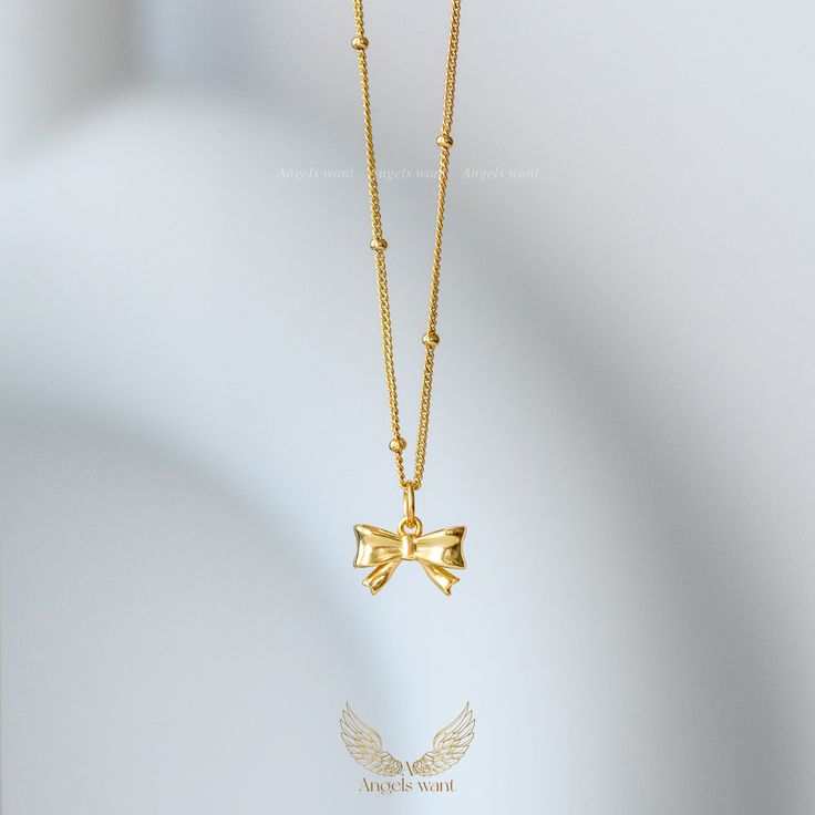 This delicate, feminine bow pendant necklace is made of 925 Sterling Sliver and gold plated.  It can be worn on its own, or stacked with other necklaces.  This necklace is the perfect choice for a variety occasions, whether it is as a birthday, anniversary, or just to mark a significant day, you will have the perfect accessory to make that moment special.  This wonderful piece of jewelry will make a sweet, thoughtful, and precious gift for yourself or that special someone. *Material: 925 Sterlin Gold Necklaces With Butterfly Knot For Gift, Gold Butterfly Knot Necklace For Gift, Gold Necklace With Butterfly Knot For Gift, Gold Bow Necklaces For Gifts, Gold Necklaces With Bow For Gifts, Gold Necklaces With Bow As Gifts, Gold Necklace With Bow As Gift, Gold Necklace With Bow For Gifts, Jewelry Content