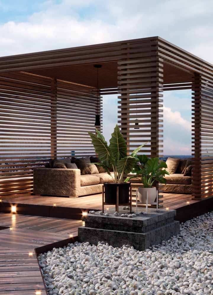 an outdoor living area with wood slats